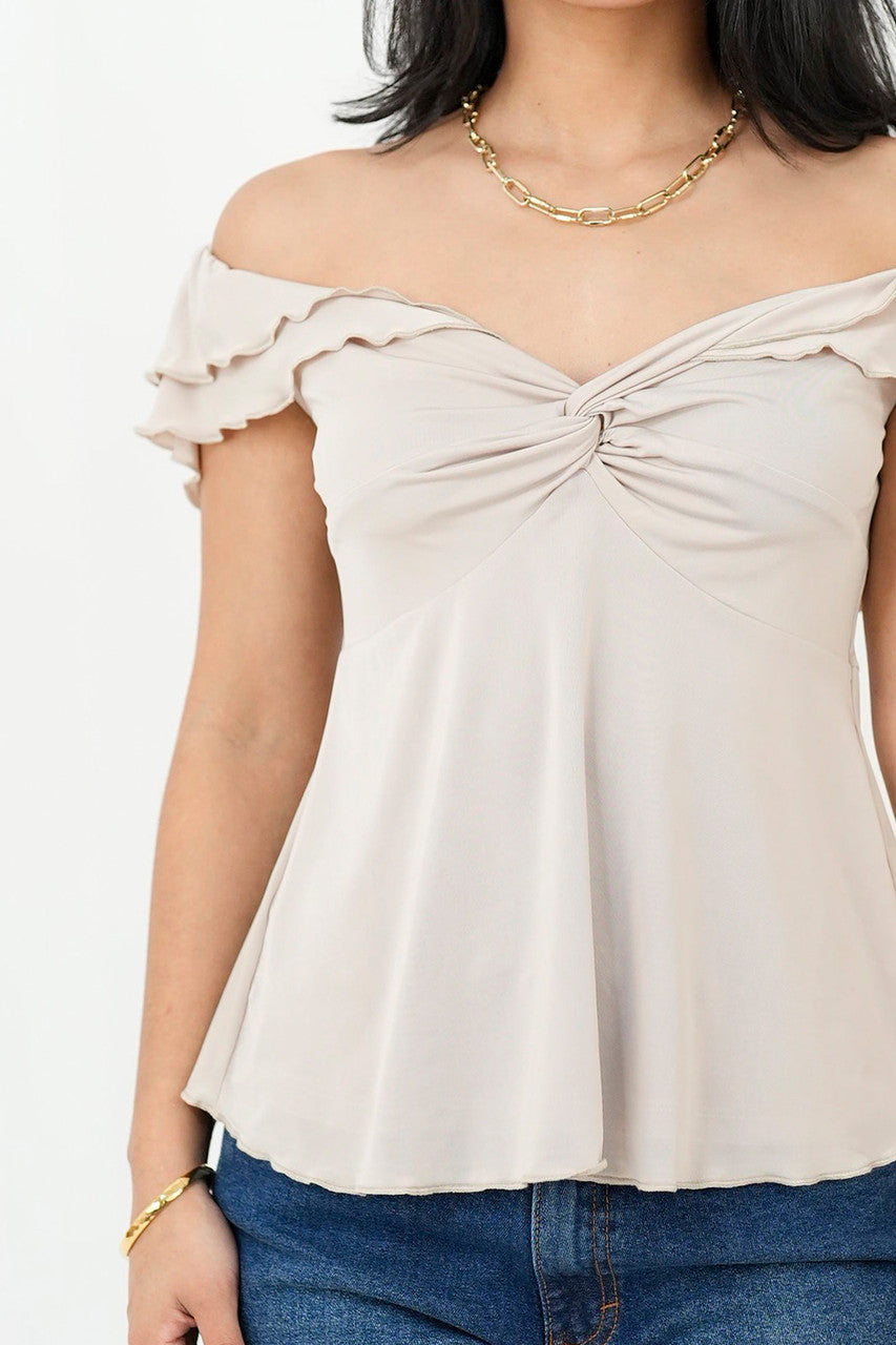 Polo off shoulder nudo en escote
