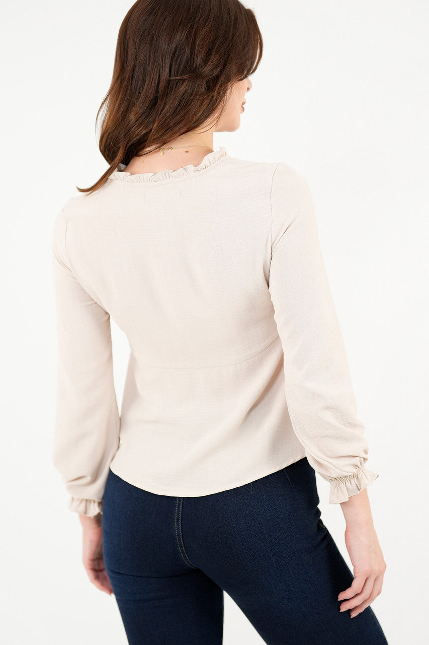 Blusa manga larga con Bobo en el escote