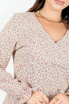 Blusa manga larga en seda corrugada con escote V