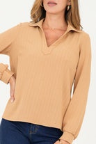 Blusa manga larga cuello sport