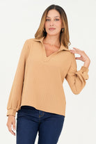 Blusa manga larga cuello sport