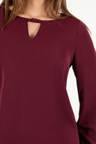 Blusa manga larga en seda con escote ojal