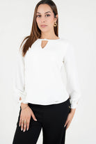 Blusa manga larga en seda con escote ojal
