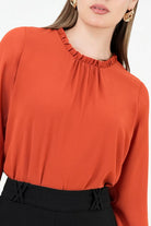 Blusa manga larga en gasa con detalle recogido