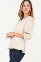 Blusa manga 3/4 escote ojal corte clásico