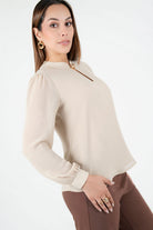 Blusa manga larga con cuello neru