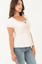 Blusa manga corta escote con bobito