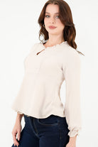Blusa manga larga con Bobo en el escote