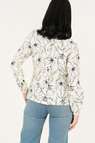 Blusa manga larga abertura lagrima