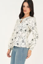 Blusa manga larga abertura lagrima