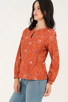 Blusa manga larga abertura lagrima