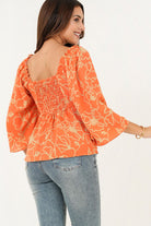 Blusa manga 3/4 acampanada escote corazón