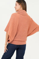Poncho cuello alto