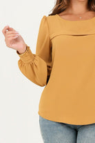 Blusa manga larga pestaña ancha