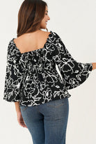 Blusa manga 3/4 acampanada escote corazón