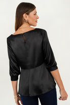 Blusa manga 3/4 escote ojal corte clásico