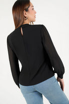 Blusa manga larga con cuello neru
