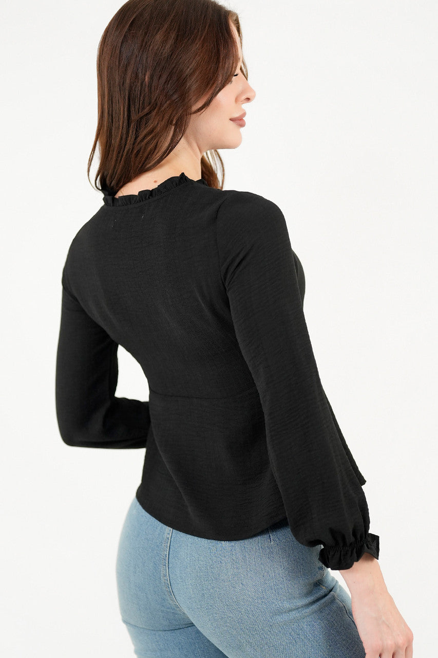 Blusa manga larga con Bobo en el escote