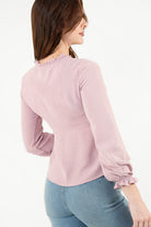 Blusa manga larga con Bobo en el escote