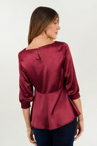 Blusa manga 3/4 escote ojal corte clásico